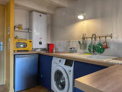 Cuisine ou kitchenette dans l'établissement Le Studio Madeleine