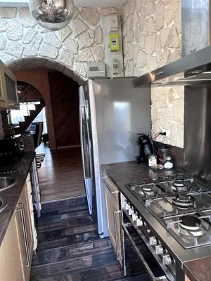 Cuisine ou kitchenette dans l'établissement Maison Digoin