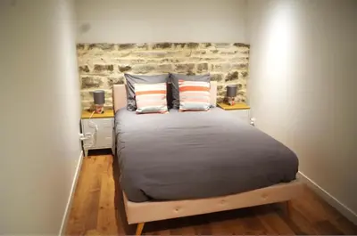 Un ou plusieurs lits dans un hébergement de l'établissement Urban Oasis, Appartement Chic et Neuf