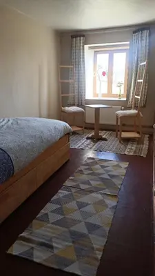 Un ou plusieurs lits dans un hébergement de l'établissement Chambre Swingy - Gîte les Zazous