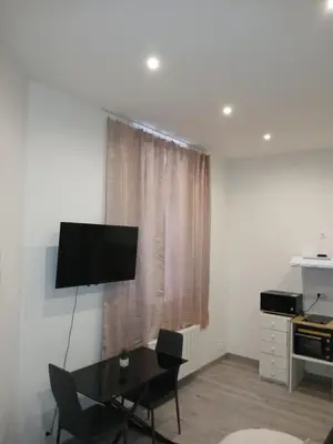 Télévision ou salle de divertissement dans l'établissement Appartement plein pied