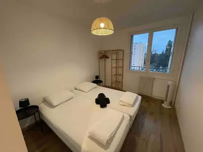 Un ou plusieurs lits dans un hébergement de l'établissement Agréable logement 8 personnes