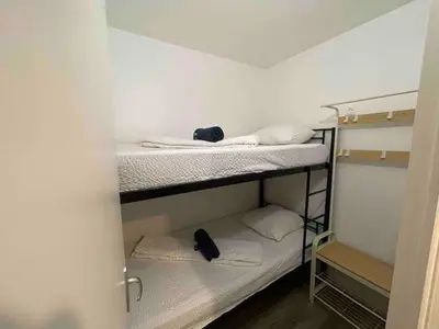 Un ou plusieurs lits dans un hébergement de l'établissement Agréable logement 8 personnes