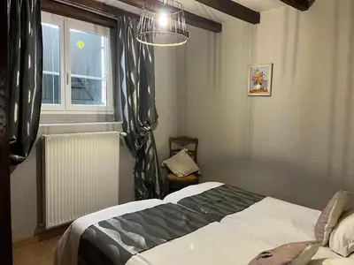 Un ou plusieurs lits dans un hébergement de l'établissement Gîte Le tilleul