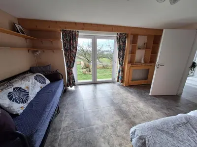 Un ou plusieurs lits dans un hébergement de l'établissement Chambre Jazzy - Gîte les Zazous