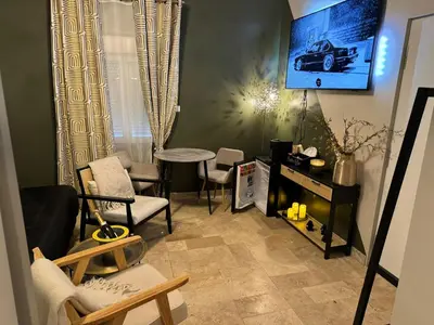 Télévision ou salle de divertissement dans l'établissement Ma Campagne SPA Suite