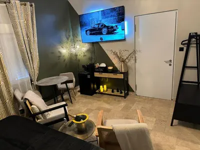 Télévision ou salle de divertissement dans l'établissement Ma Campagne SPA Suite