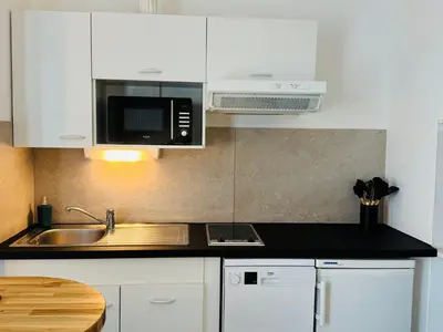 Cuisine ou kitchenette dans l'établissement Centre-ville, parking facile,confortable