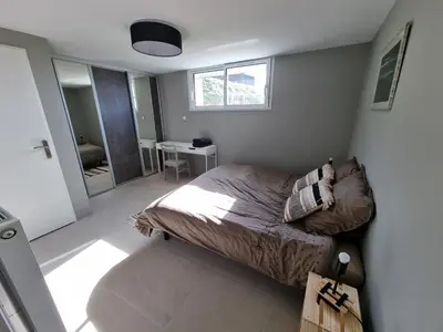 Un ou plusieurs lits dans un hébergement de l'établissement Appartement au cœur des vignes