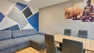 Coin salon dans l'établissement Charmant T1 - Chevigny-St-Sauveur