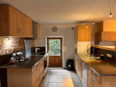 Cuisine ou kitchenette dans l'établissement Le Coup de Coeur Terrasse Calme