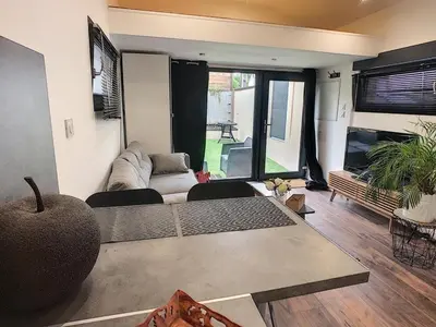 Coin salon dans l'établissement Welcome Home