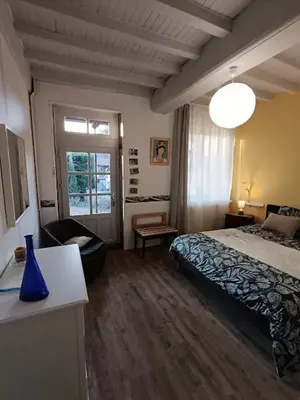 Un ou plusieurs lits dans un hébergement de l'établissement Chambre d'hôte la Chanée