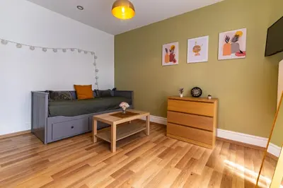 Télévision ou salle de divertissement dans l'établissement Le STUDIO 2
