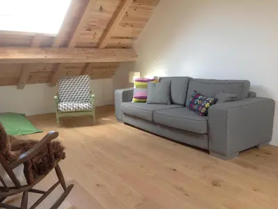 Coin salon dans l'établissement Au Pied des Vignes