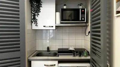 Cuisine ou kitchenette dans l'établissement Le Cocon Central - Gare