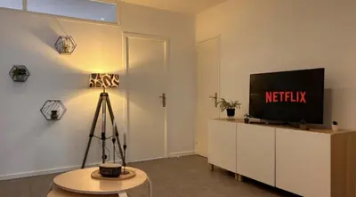 Télévision ou salle de divertissement dans l'établissement Le St Antoine Central - Gare