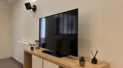 Télévision ou salle de divertissement dans l'établissement L'élégant Central - Cosy
