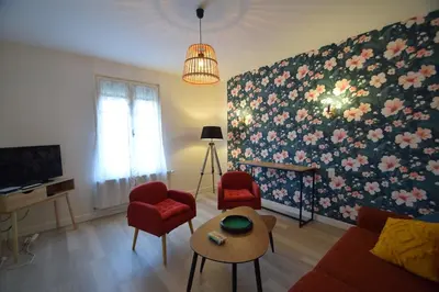 Télévision ou salle de divertissement dans l'établissement Le jardin caché, maison indépendante classée 3 étoiles