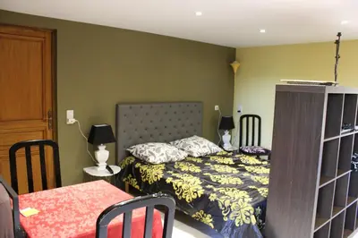Un ou plusieurs lits dans un hébergement de l'établissement Le Fauverney Lodge