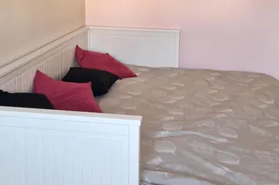 Un ou plusieurs lits dans un hébergement de l'établissement Charmant duplex avec grand balcon
