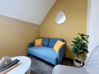 Coin salon dans l'établissement L'Authentique Centre &Gare