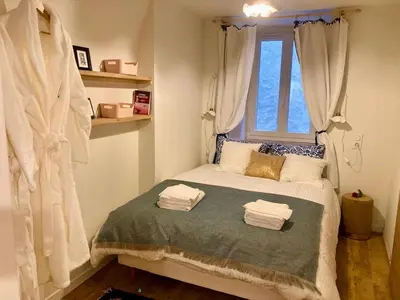 Un ou plusieurs lits dans un hébergement de l'établissement Studio cosy au cœur d'Arbois