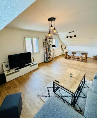 Télévision ou salle de divertissement dans l'établissement Le Molay