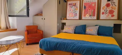 Un ou plusieurs lits dans un hébergement de l'établissement La Popinette Chambre d'hôte