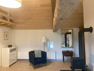 Coin salon dans l'établissement Gite Le Nid Abord