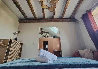 Un ou plusieurs lits dans un hébergement de l'établissement Domaine Saint Loup - Chambres d'hôtes