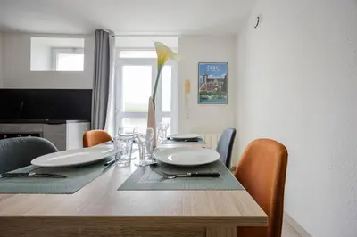 Coin salon dans l'établissement Le Royal Dole - Parking Gratuit - Appartement Moderne & Cosy