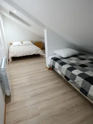 Un ou plusieurs lits dans un hébergement de l'établissement Studio duplex au coeur de Dijon
