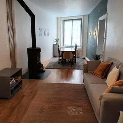 Coin salon dans l'établissement Maison de village au calme 4 chambres