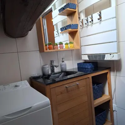 Cuisine ou kitchenette dans l'établissement Sous un charmant toit