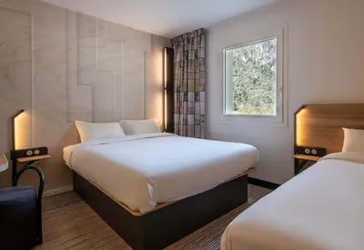 Un ou plusieurs lits dans un hébergement de l'établissement B&B HOTEL Mâcon Sud 3 étoiles