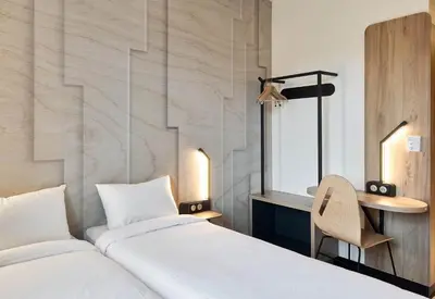 Un ou plusieurs lits dans un hébergement de l'établissement B&B HOTEL Mâcon Sud 3 étoiles