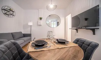 Télévision ou salle de divertissement dans l'établissement La Citadine