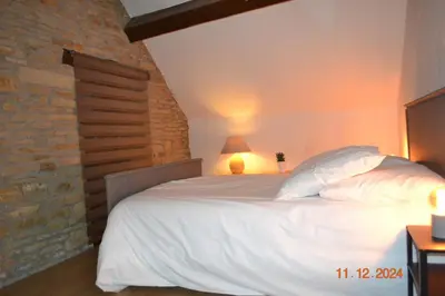 Un ou plusieurs lits dans un hébergement de l'établissement Gîte Le Cabanac