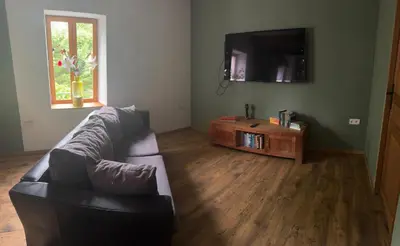 Télévision ou salle de divertissement dans l'établissement Maison Moulin Martin