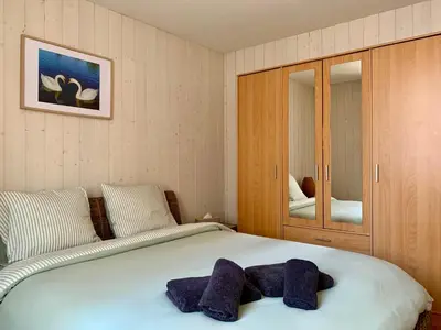 Un ou plusieurs lits dans un hébergement de l'établissement Petite Maison Cosy