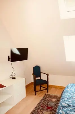 Télévision ou salle de divertissement dans l'établissement Au cœur de la Citadelle