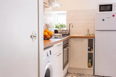 Cuisine ou kitchenette dans l'établissement Le Ptit St Pierre - Studio en Hyper Centre