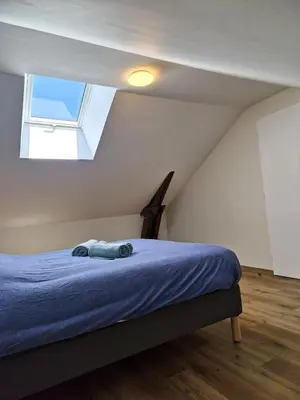 Un ou plusieurs lits dans un hébergement de l'établissement Appartement 3 chambres