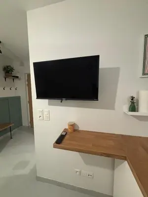 Télévision ou salle de divertissement dans l'établissement Échappée Dijonnaise - studio cosy au cœur du centre ville