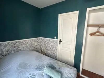 Un ou plusieurs lits dans un hébergement de l'établissement Le Cosy