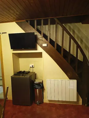 Télévision ou salle de divertissement dans l'établissement F2 appartement de campagne