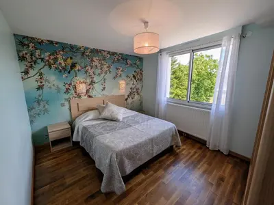 Un ou plusieurs lits dans un hébergement de l'établissement Maison rénovée au bord de la Saône avec terrasse et jardin - FR-1-583-463