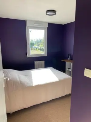 Un ou plusieurs lits dans un hébergement de l'établissement Appartement 3 chambres et 2 Parkings