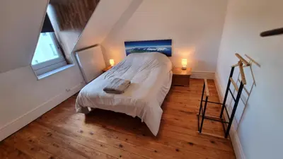 Un ou plusieurs lits dans un hébergement de l'établissement Appartement T5 rénové centre ville